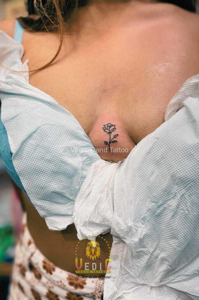unique-small-rose-tattoo-on-breast-tatu shop