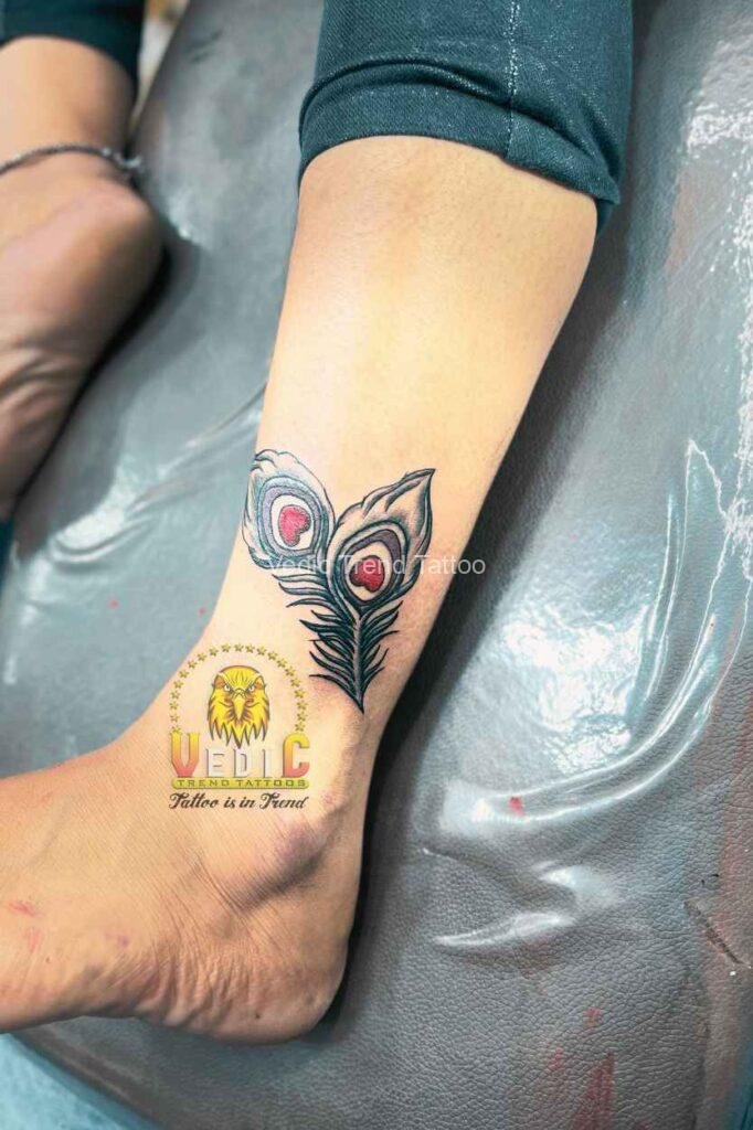 tattooda-best tattoo near me-Peacock red feather-tattoo for leg