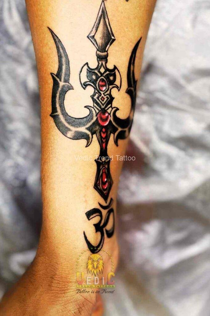 Cover-up Tattoo-trishul with om tattoo on forearm