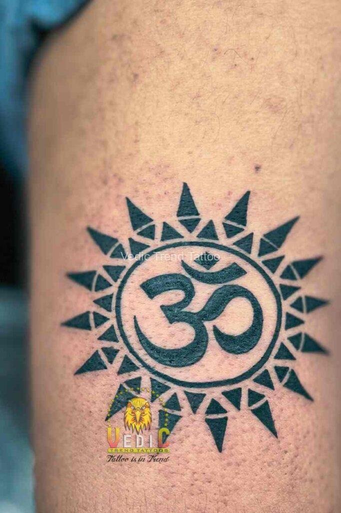 Best Tattoo Studio-triangleshape-sun-inside-om-tattoo-for-male-shoulder