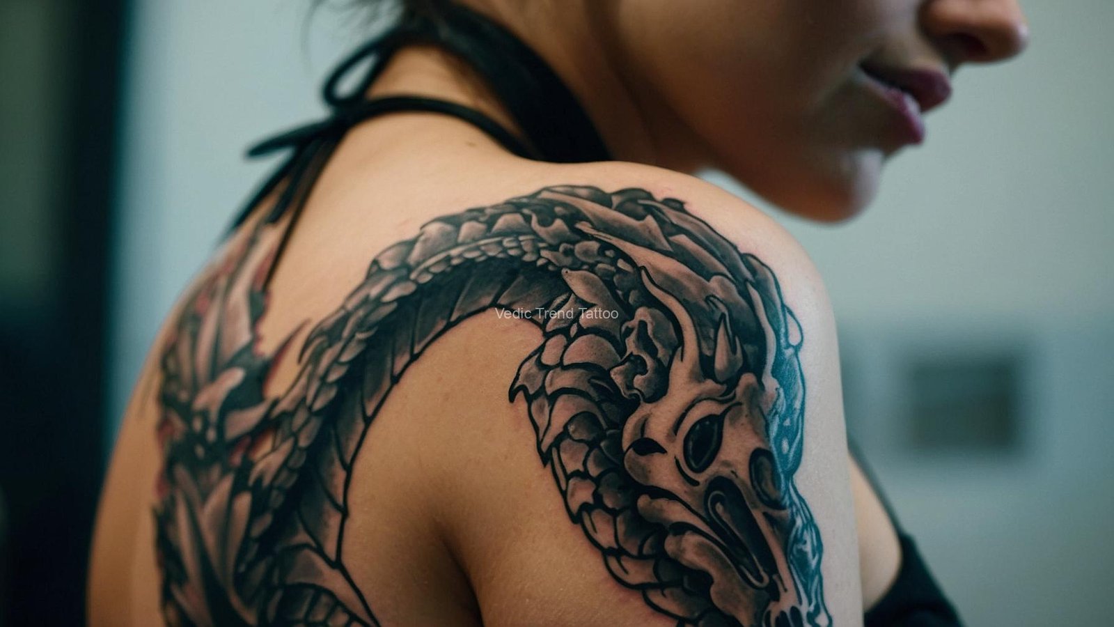 Dragon tattoo design on a girl's shoulder and back by Vedic Trend Tattoo