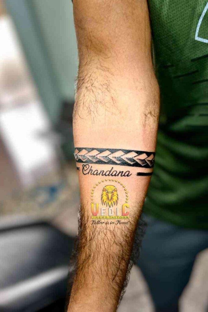 Arm-band-tattoo and male hand- best top 10 tattoo shop near me