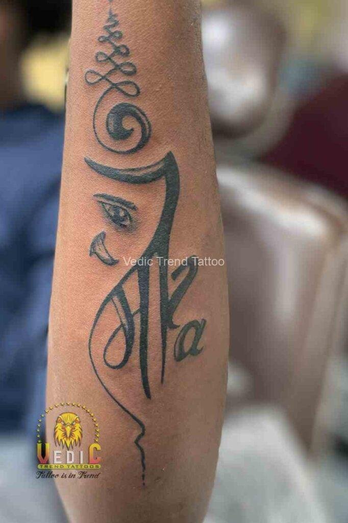 Ganesh tattoo on wrist