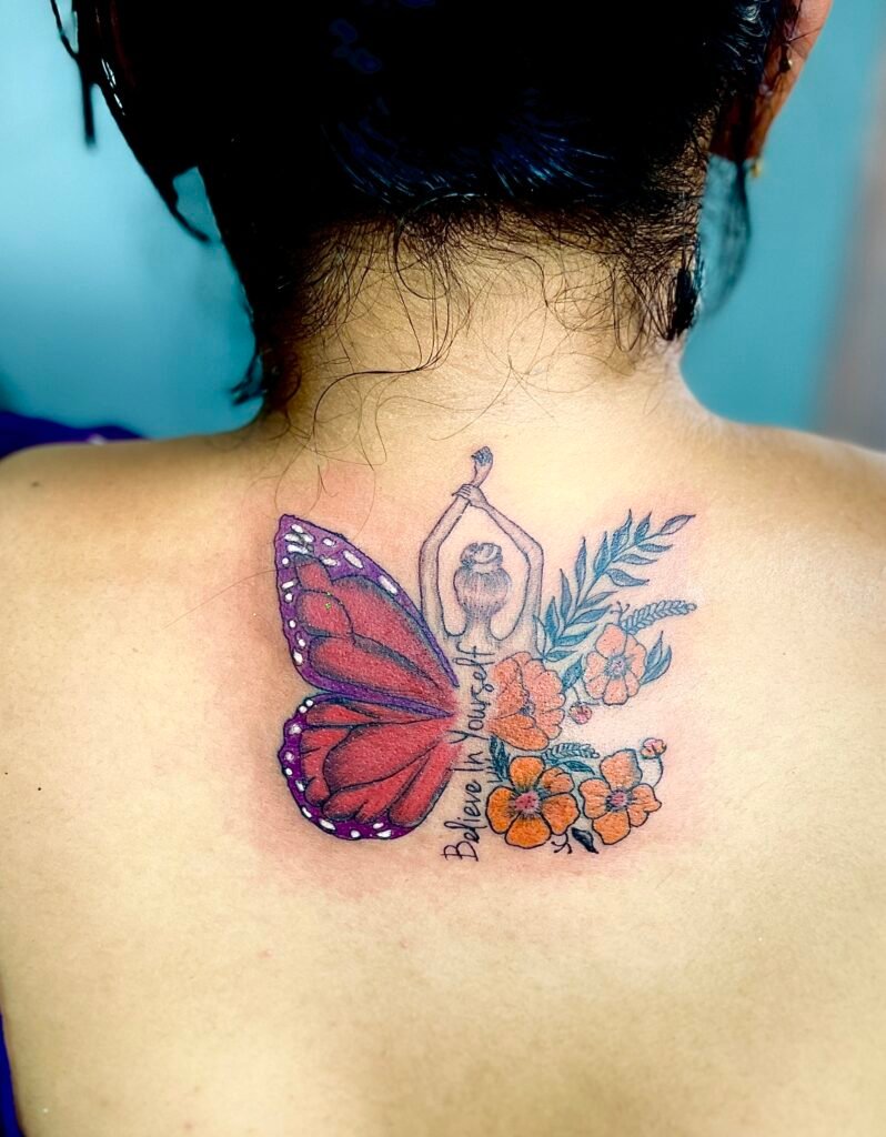 Graceful angel and flower tattoo on a woman's back, blending divine beauty with floral elegance. Perfect for bold, feminine body art.